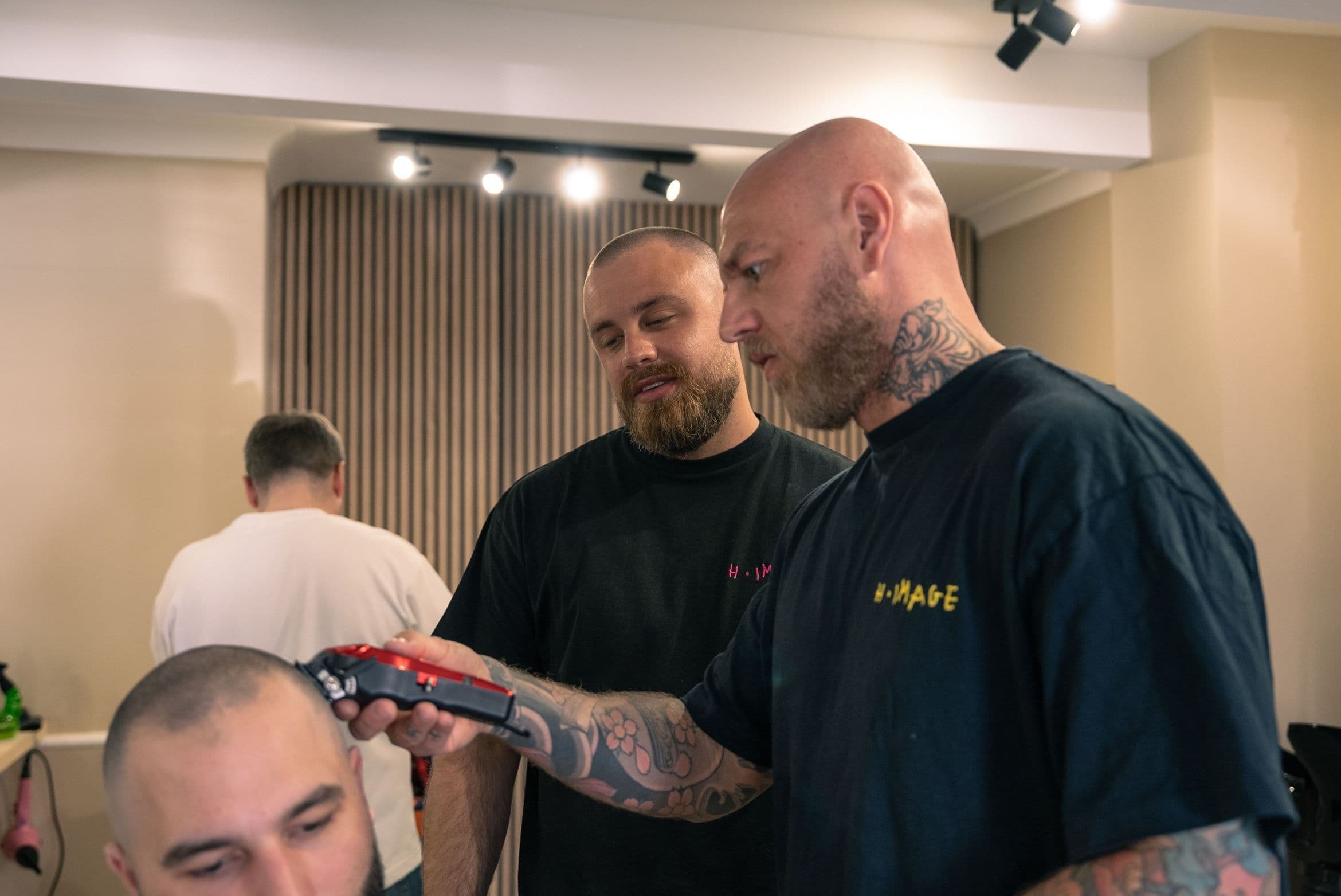 Two barbers standing together